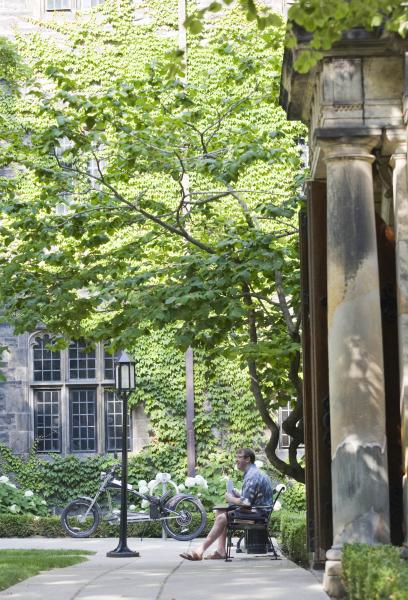 A TST student relaxing in the Trinity College Courtyard